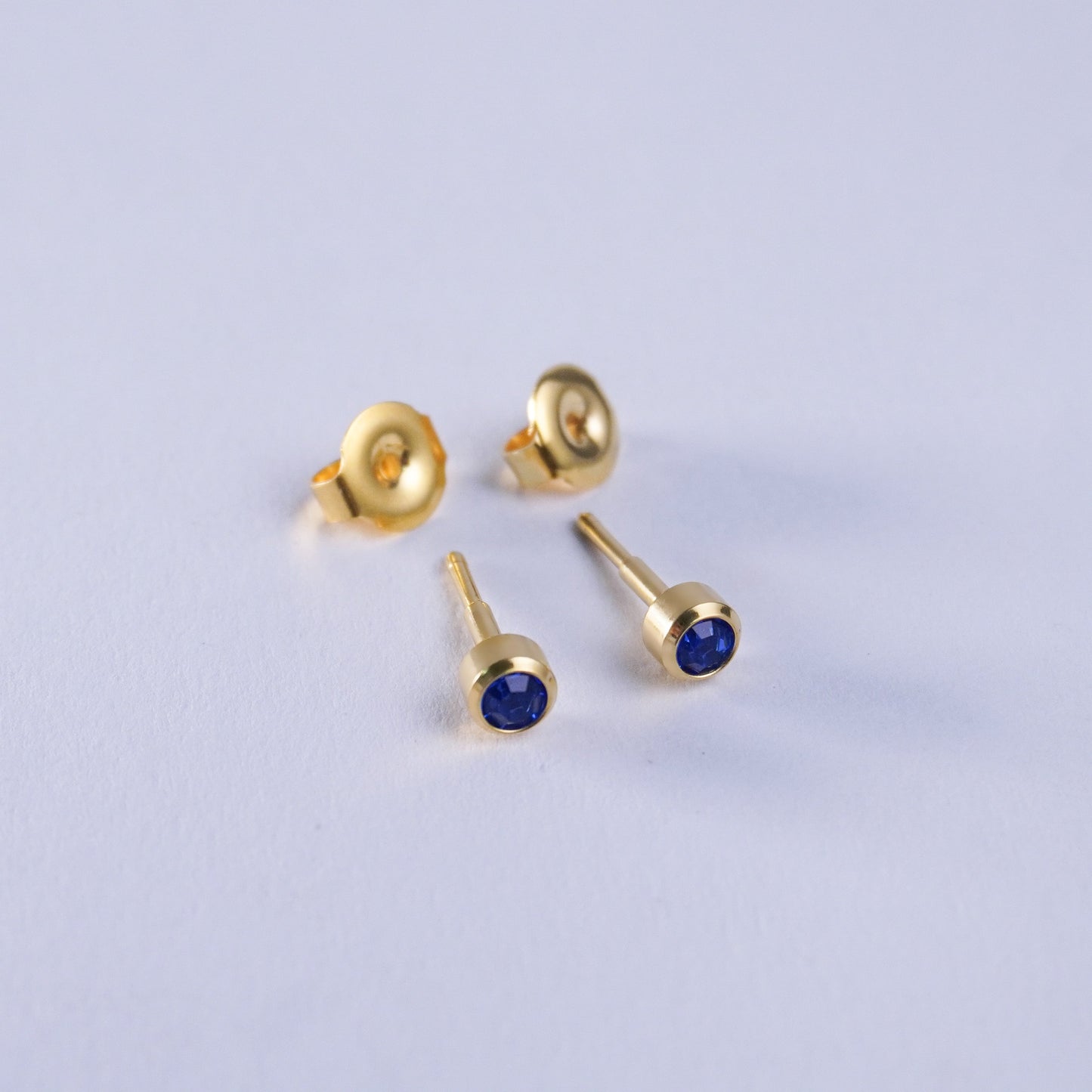 September – Sapphire Bezel Set