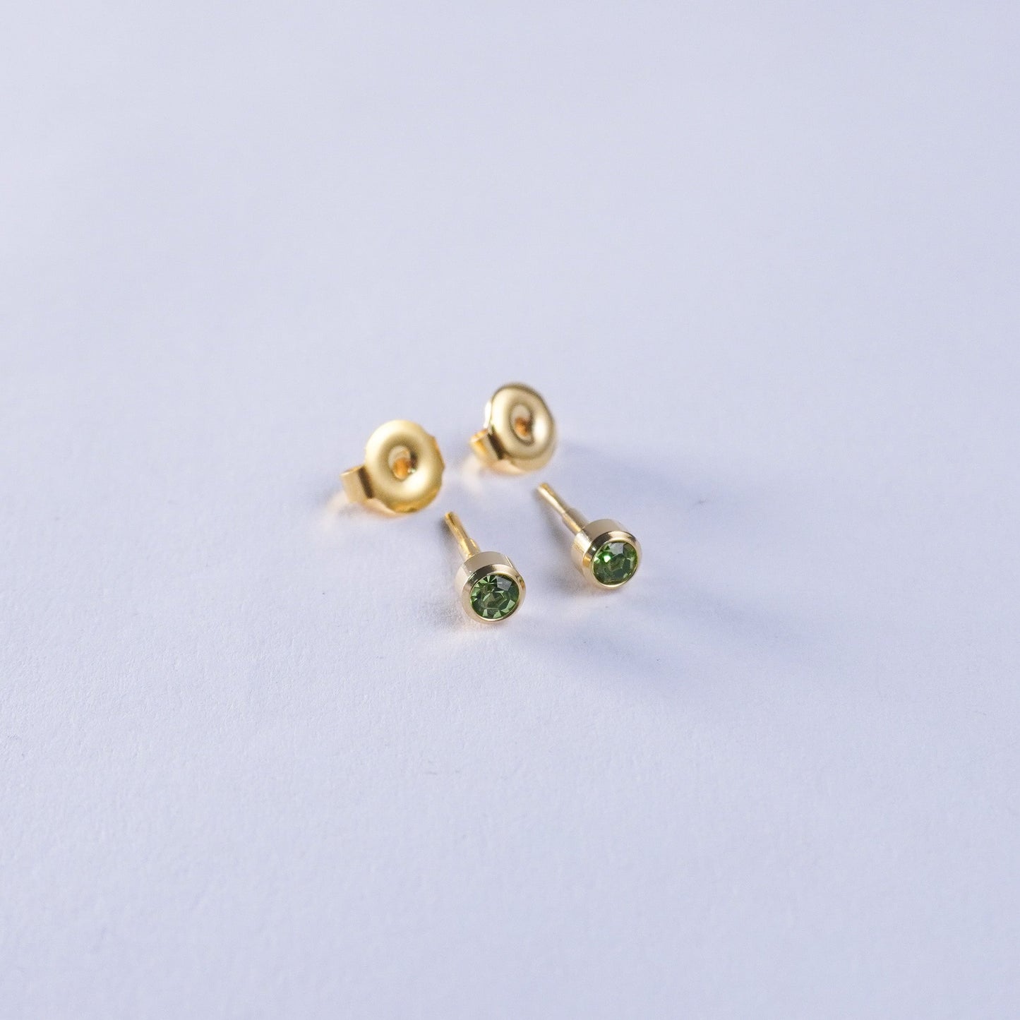 August – Peridot Bezel Set