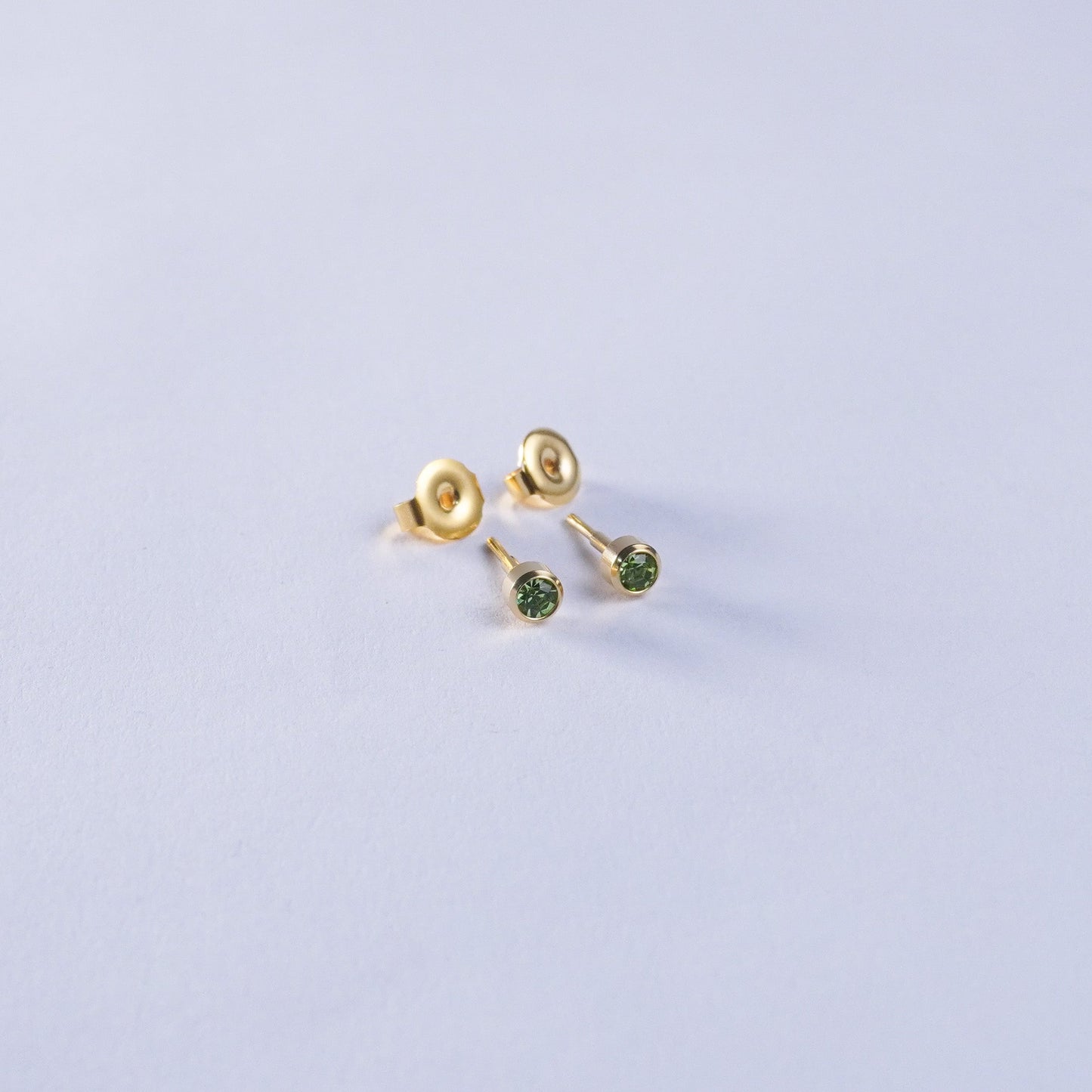 August – Peridot Bezel Set