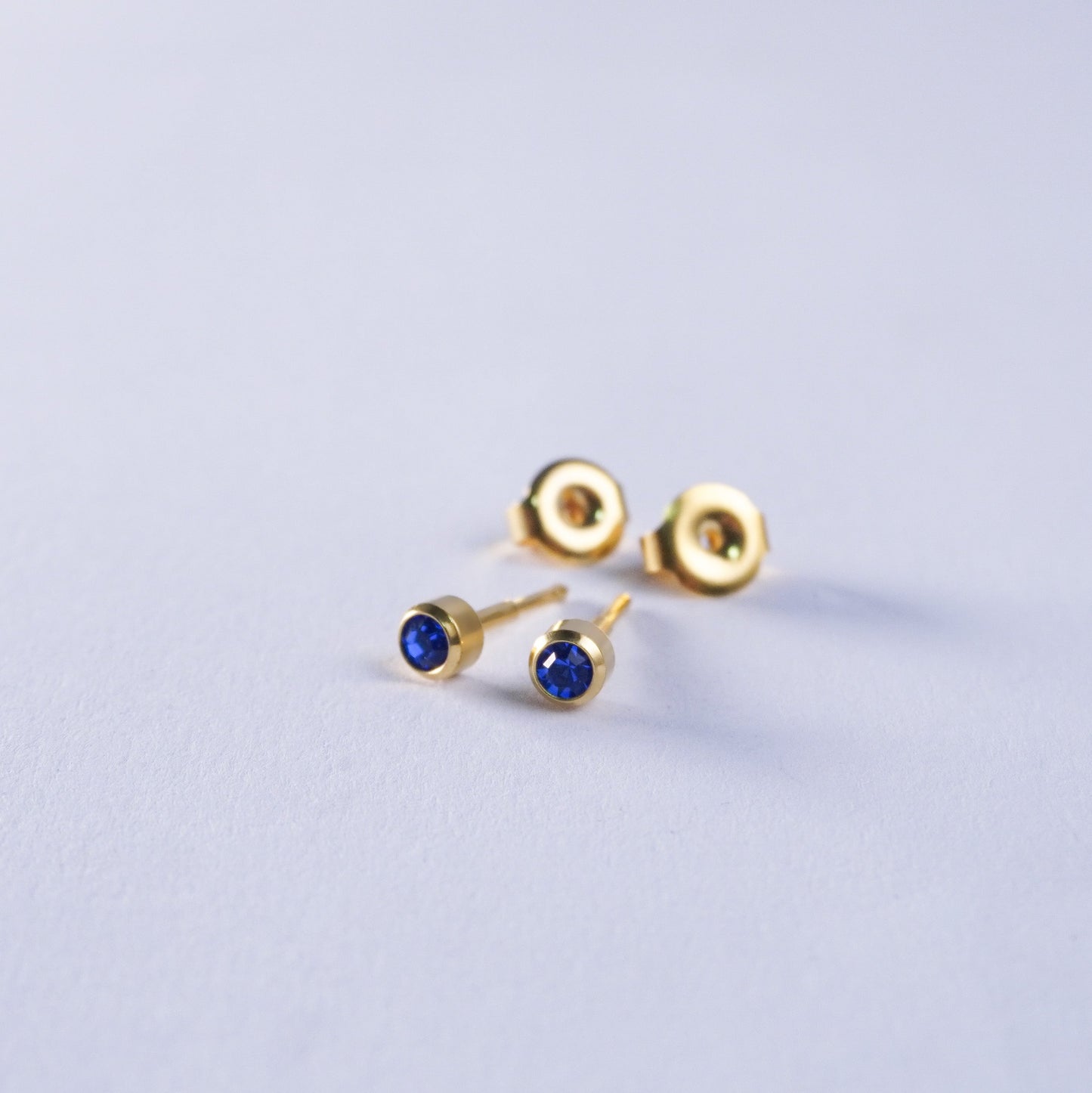September – Sapphire Bezel Set